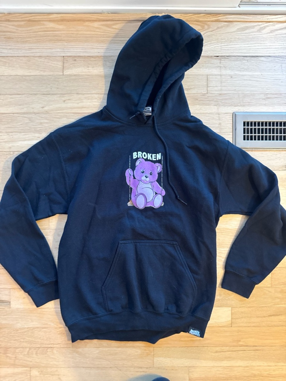 Broken Promises Black Hoodie with Purple 'Broken' Teddy Graphic